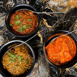 1947 Eatery and Lounge signature dishes 1947 Butter ChickenChili PaneerLamb Seekh Kebab